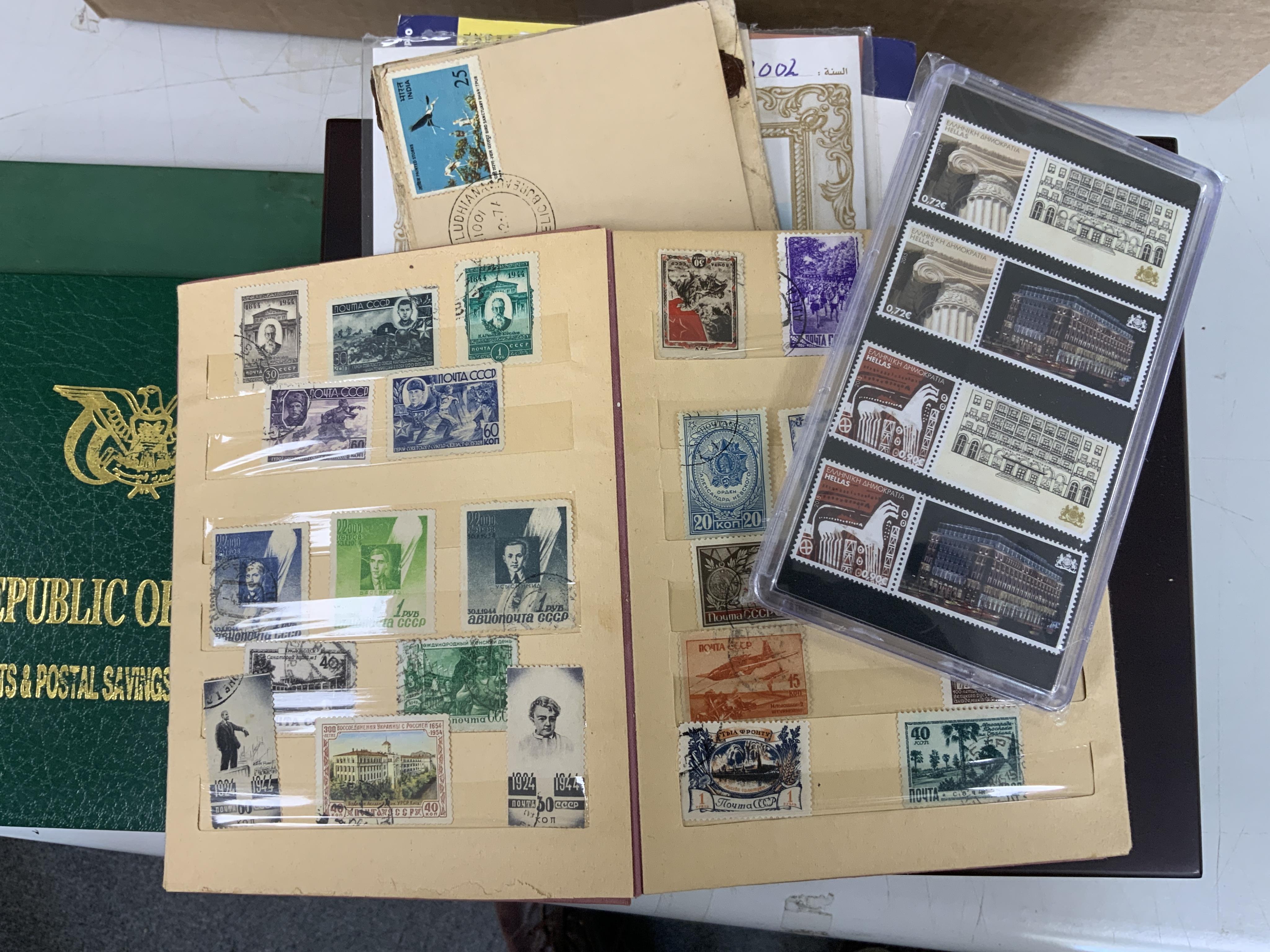 A collection of world stamps including two case selections of stamps in individual perspective cases from the Philatelic Legends ‘Historic Stamps’ collection, including Vichy France, US Civil War, the Cape triangle stamp